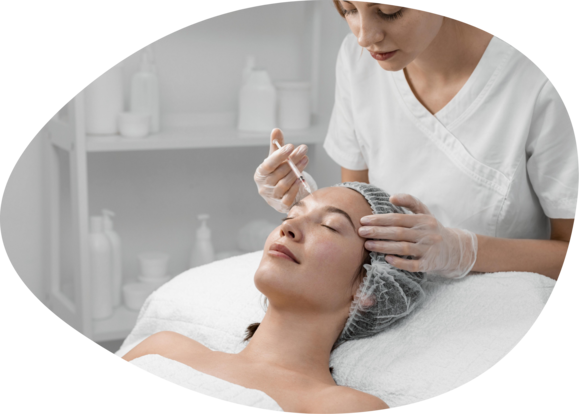 beautician doing filler injection female client